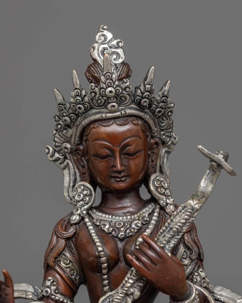 saraswati with instrument statue