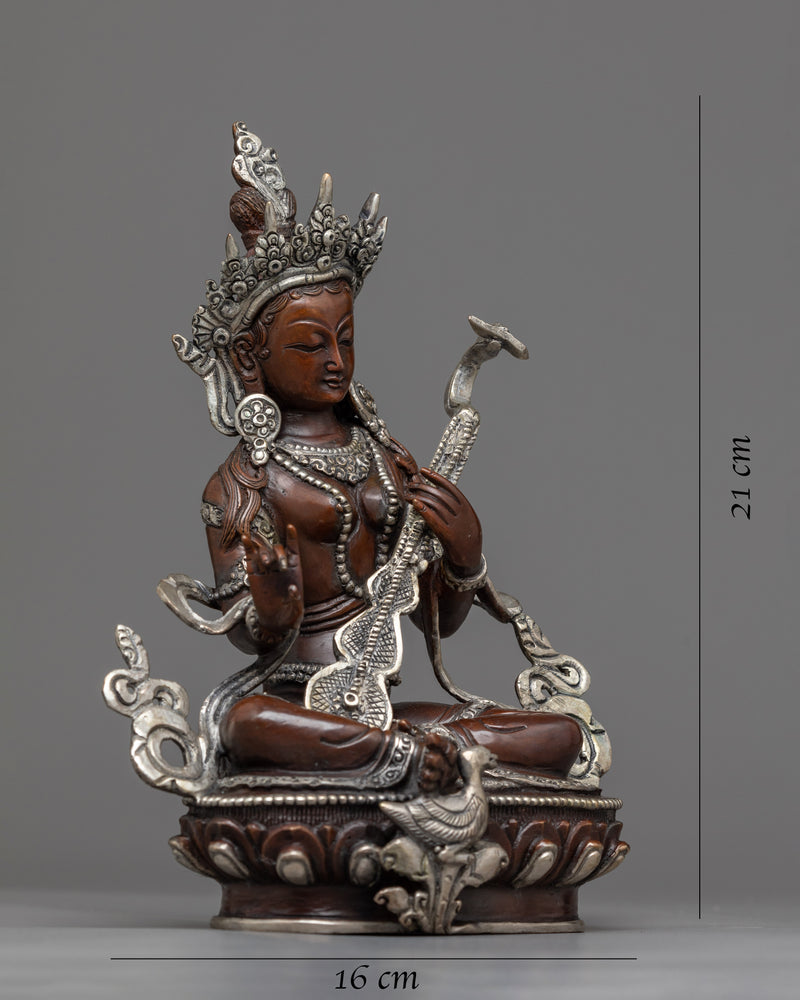 saraswati with instrument statue